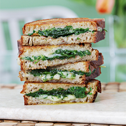 Grilled cheese sandwich with garlic confit and baby arugula