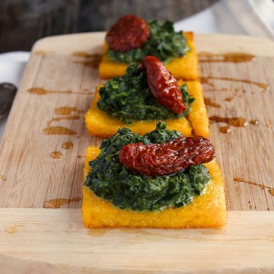 Roasted polenta with spinach and sun-dried tomatoes